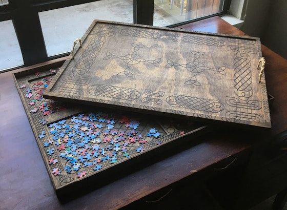 Puzzle board and storage tray.